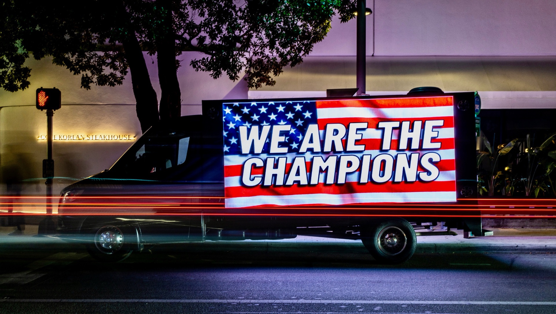 Presidential Advertising LED truck on a downtown street at night
